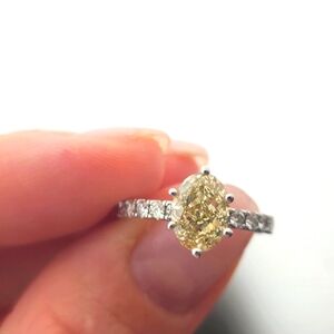 GIA 1.68 FANCY YELLOW OVAL SOLITAIRE VVS1 5 1/2